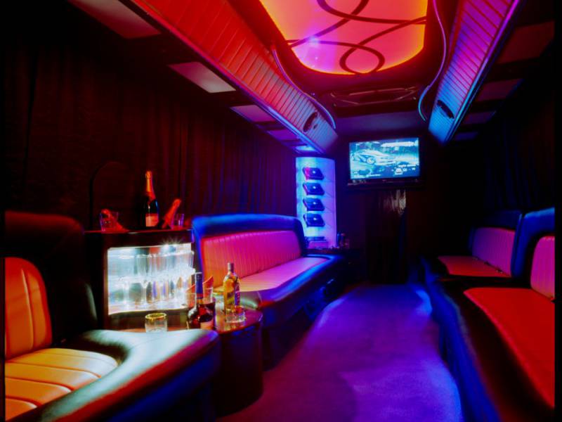 image showing sub-lit interior of luxurious partybus